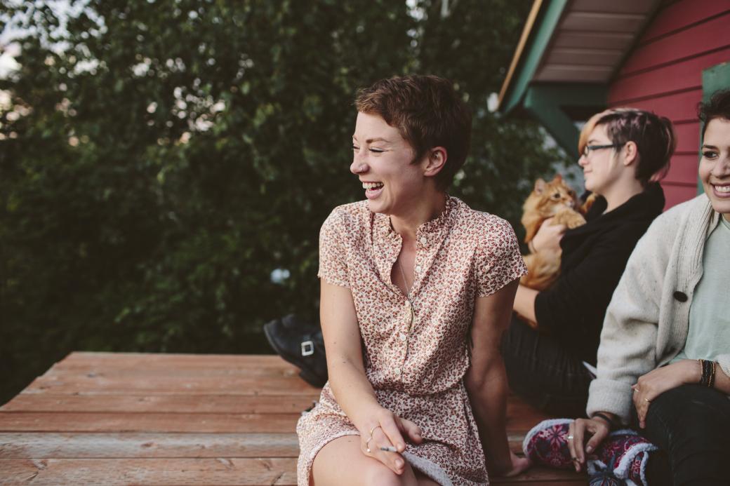 Woman laughing outdoors