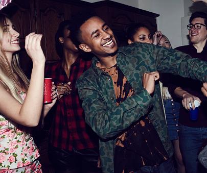 Youths dancing at a party